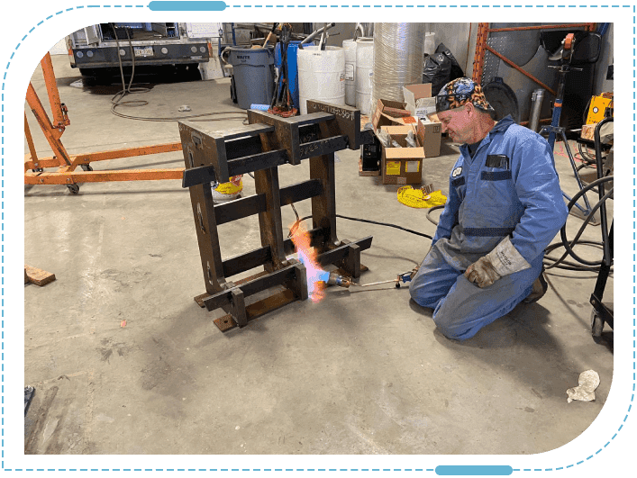 Man welding in industrial workshop
