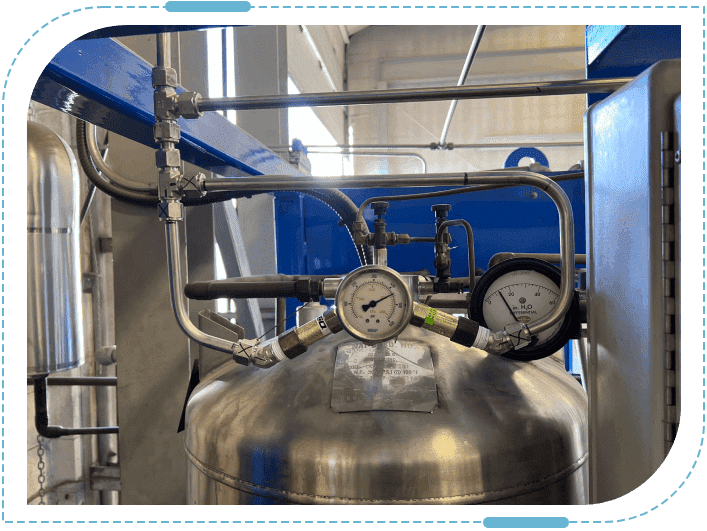 Industrial pressure gauge on metal tank