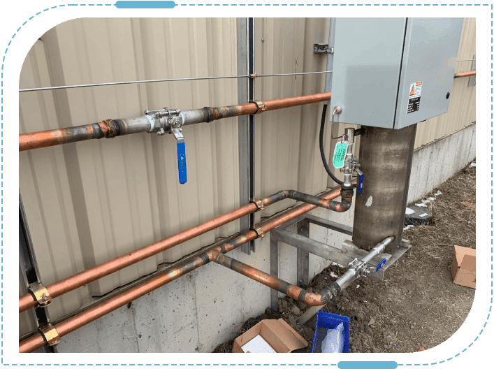 Industrial piping system on building exterior